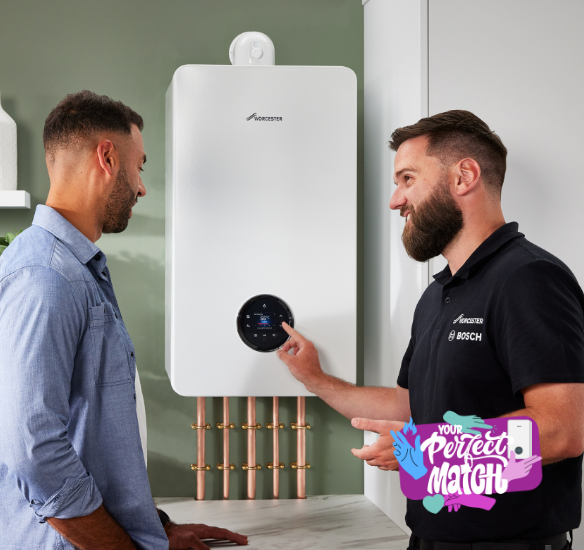 Installer showing how to use a boiler to the buyer